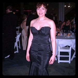 Black floor length mermaid evening dress.